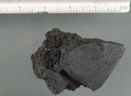 Black tar looking solid substance